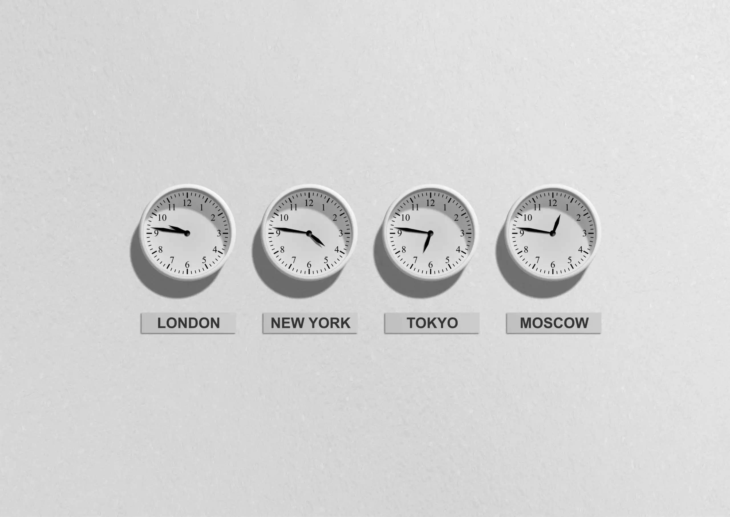 Clocks showing time zones for London, New York, Tokyo and Moscow